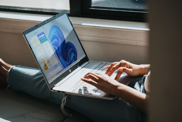 man typing on computer